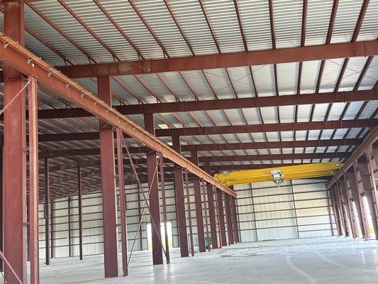 he interior of a newly constructed, large industrial steel-framed building