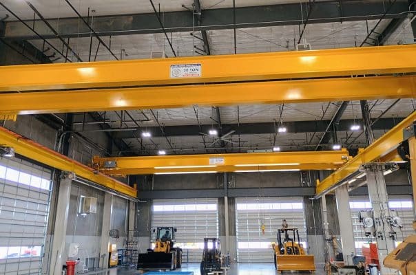  a large yellow overhead bridge crane