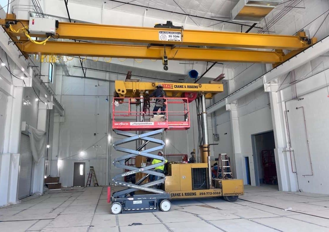 a 20-ton capacity overhead bridge crane being installed inside a industrial building